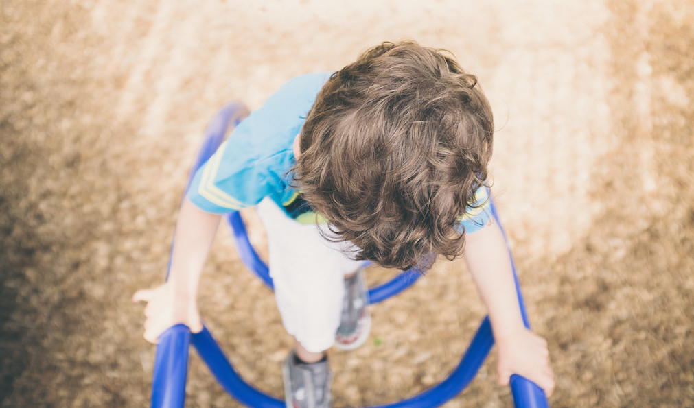 Child on playground. Photo: Sal/Flickr