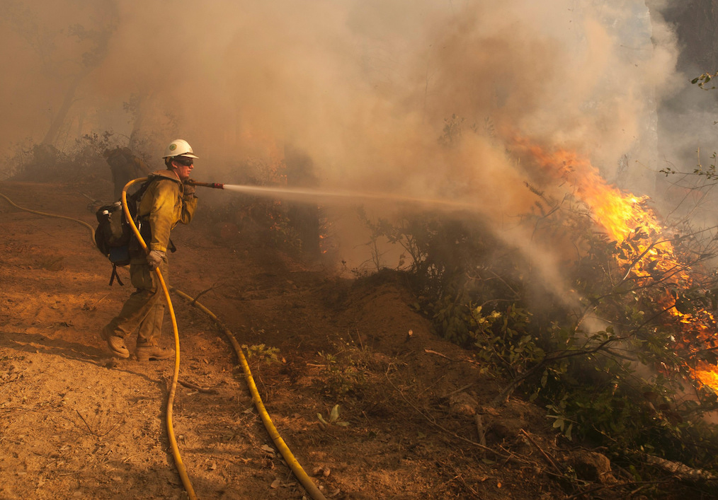 Firefighter works fire line at the Happy Camp Complex Fire in the Klamath National Forest in California. Photo: U.S. Department of Agriculture/Flickr