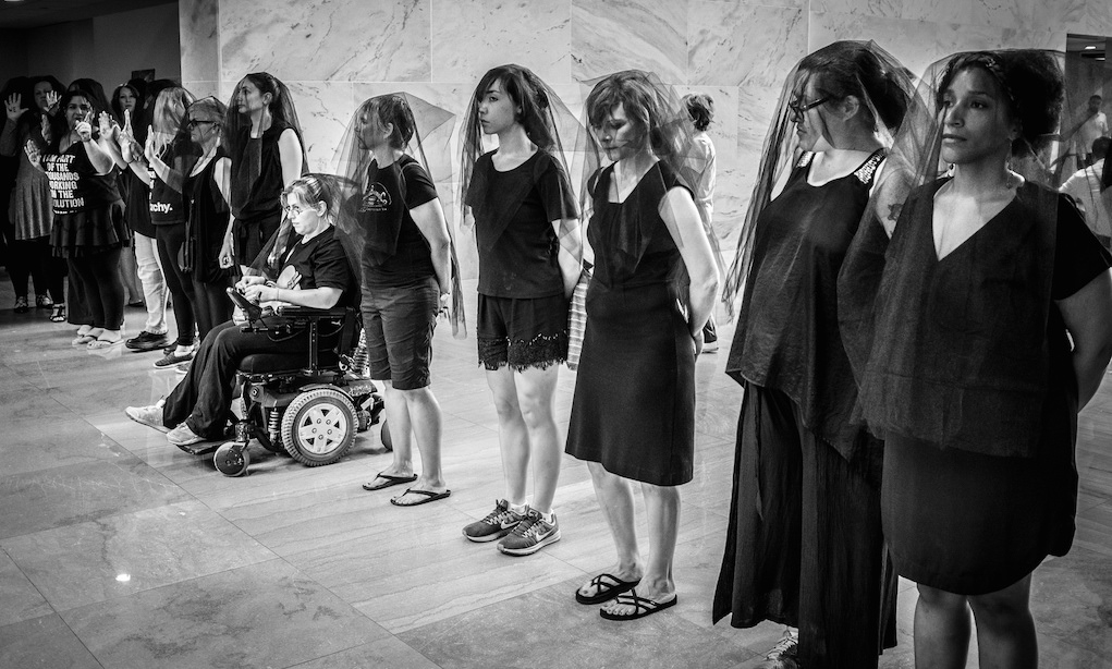 Women, many wearing black veils, protest the nomination of Brett Kavanaugh to the U.S. Supreme Court at the Hart Senate Office Building on September 7, 2018. Photo: Phil Roeder/Flickr