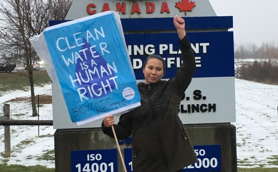 Makasa in front of Nestle sign. Photo: Emma Lui/Council of Canadians