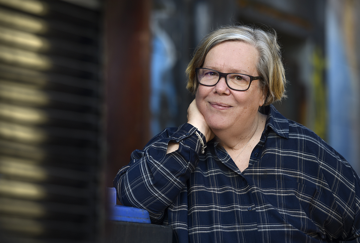 A photo of Libby Davies, the author reflecting on rabble's history