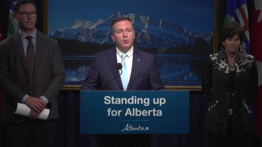 Alberta Premier Jason Kenney, flanked by Justice Minister Doug Schweitzer and Energy Minister Sonya Savage, at yesterday’s news conference in Calgary (Photo: Screenshot of Government of Alberta video).