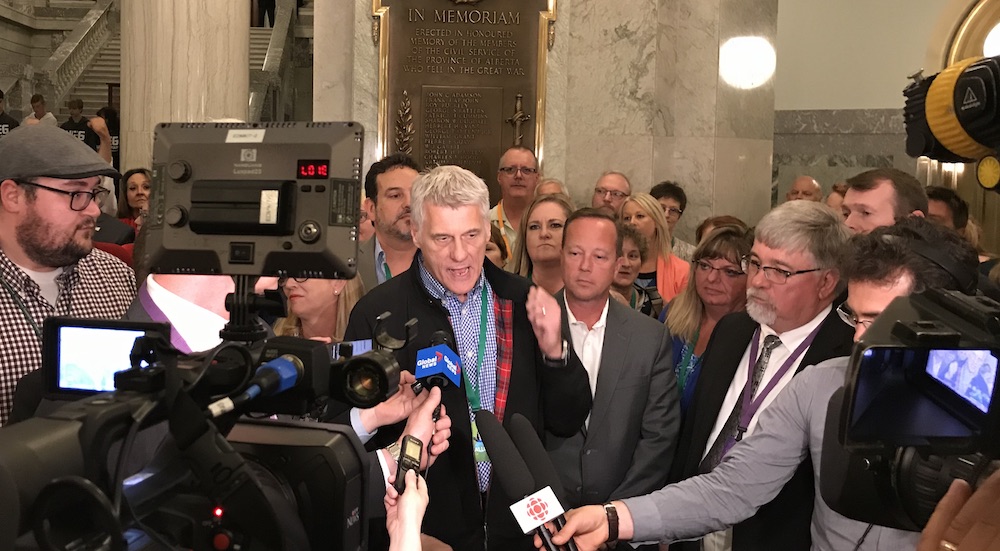 Alberta Union of Provincial Employees President Guy Smith speaks wither reporters about Bill 9 earlier this month at the Alberta Legislature (Photo: David J. Climenhaga).