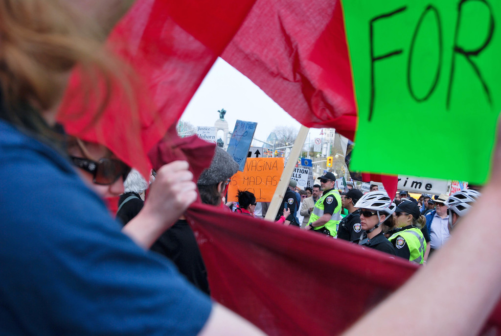 Pro-choice activists stage counter-protest. Photo: Zhu/Flickr