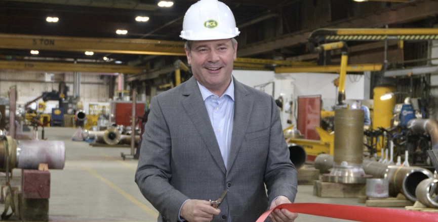 Premier Jason Kenney cutting red tape. Photo: Government of Alberta/Flickr