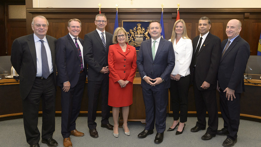 The UCP government's "blue ribbon" panel. From left to right: Mike Percy, Dave Mowat, Finance Minister Travis Toews, Janice MacKinnon, Premier Jason Kenney, Kim Henderson, Jay Ramotar and Bev Dahlby. Image: Government of Alberta