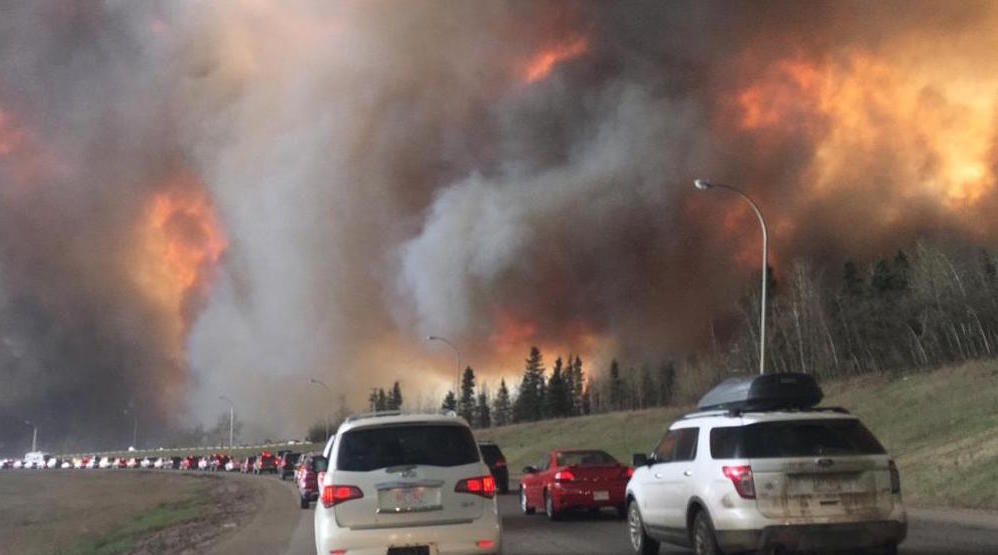 A 2016 forest fire at Fort McMurray destroyed much of the city and surrounding area and caused the evacuation of 88,000 people. Image: DarrenRD/Wikimedia Commons