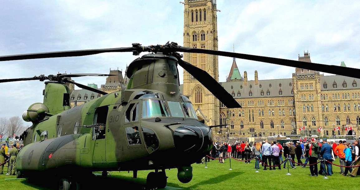 RCAF Chinook helicopter sits on the front lawn of Parliament in Ottawa. Image: Jamie McCaffrey/Flickr