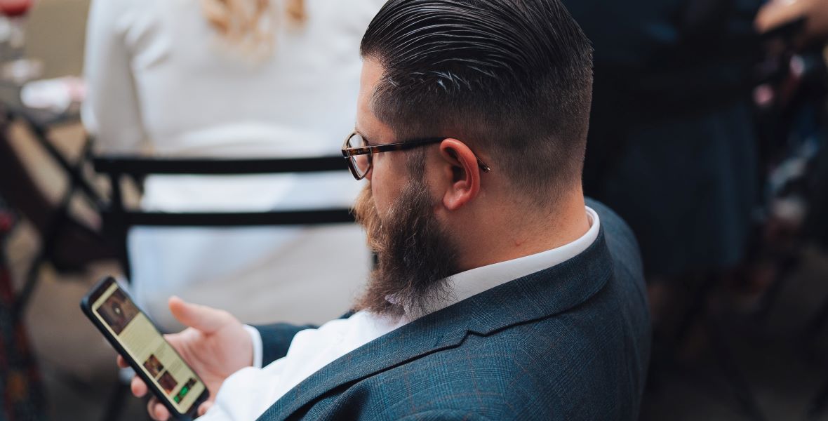 Person holding a cell phone. Image: Humphrey Muleba/Unsplash