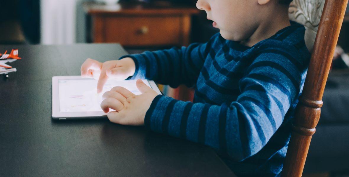 Child using tablet computer. Image: Kelly Sikkama/Unsplash