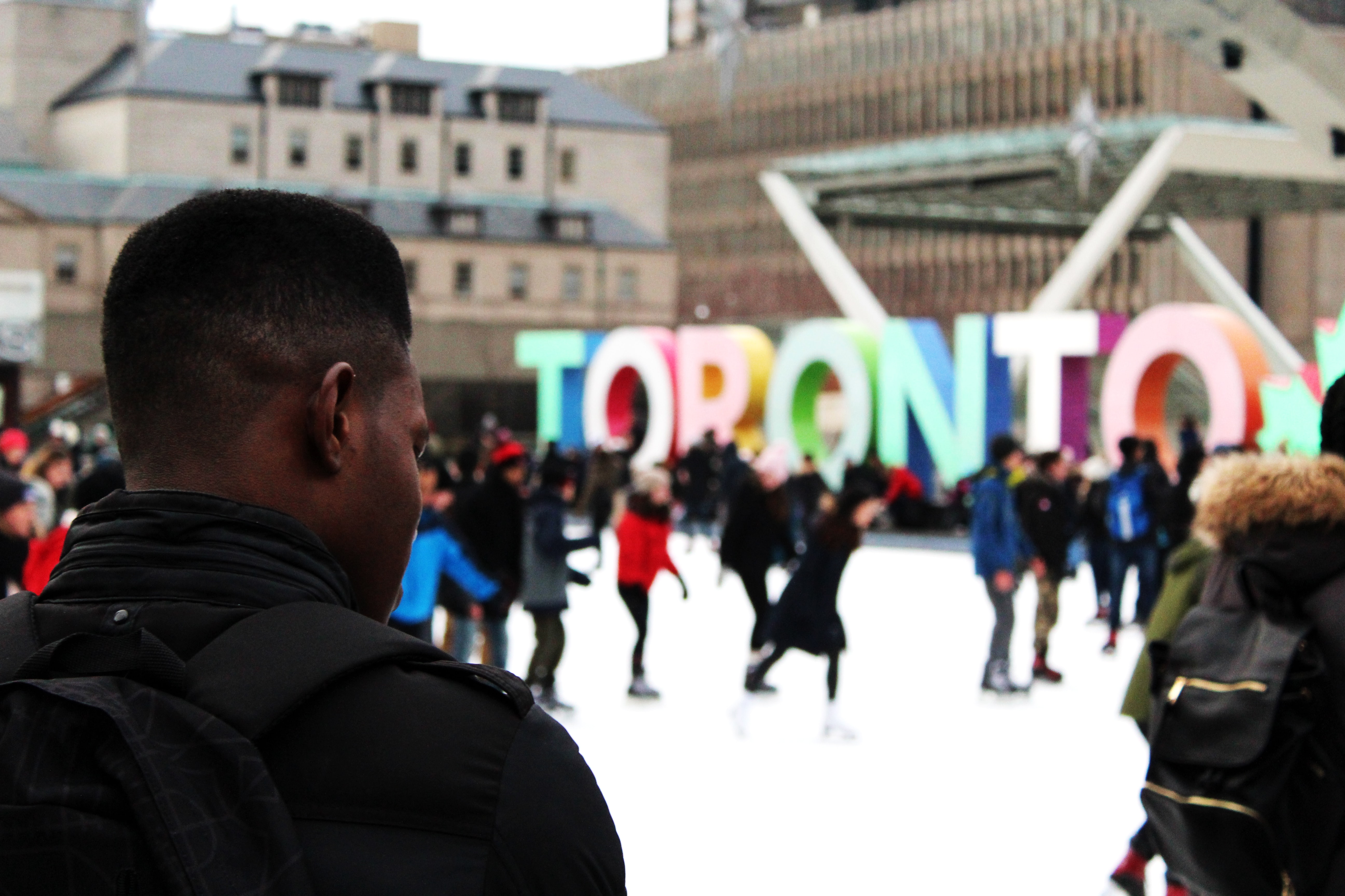 A man ice skating in Nathan Phillips Square in Toronto. Image: Brendan Church/Unsplash