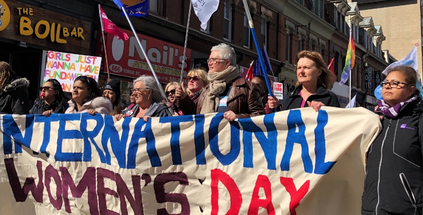 Thousands of Torontonians celebrated International Women's Day with a march calling for gender pay equity, an end to cuts to education and social welfare, support for universal childcare, and more. Image: Marites N. Sison