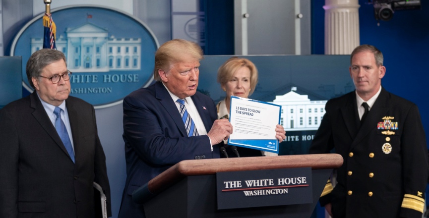 President Donald Trump holds a copy of the president's coronavirus guidelines brochure at a coronavirus (COVID-19) update briefing on Monday, March 23, 2020, in the White House. Image: Shealah Craighead/White House/Flickr