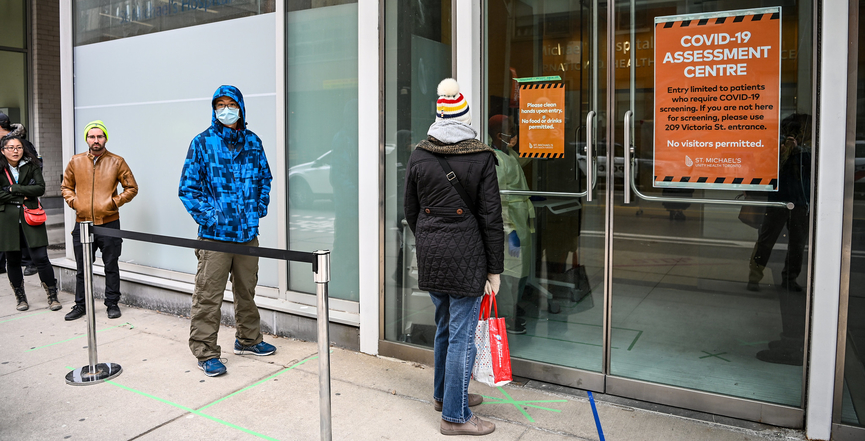 People line up to be assessed for COVID-19 at St. Michael's Hospital in Toronto. (Image: michael_swan/Flickr)