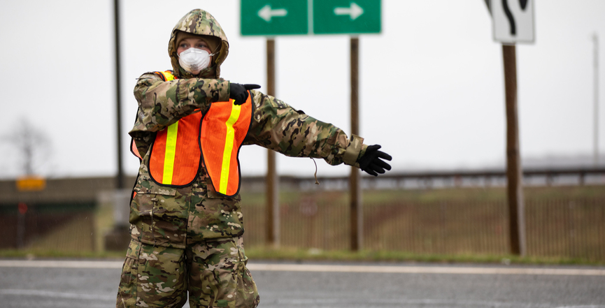 A New Jersey National Guard airman provides traffic control at a COVID-19 testing site in Holmdel, N.J., March 23, 2020. Image: The National Guard/Flickr