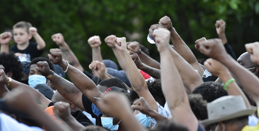 Raised fists at a George Floyd memorial rally, May 2020. Image: Anthony Crider/Flickr