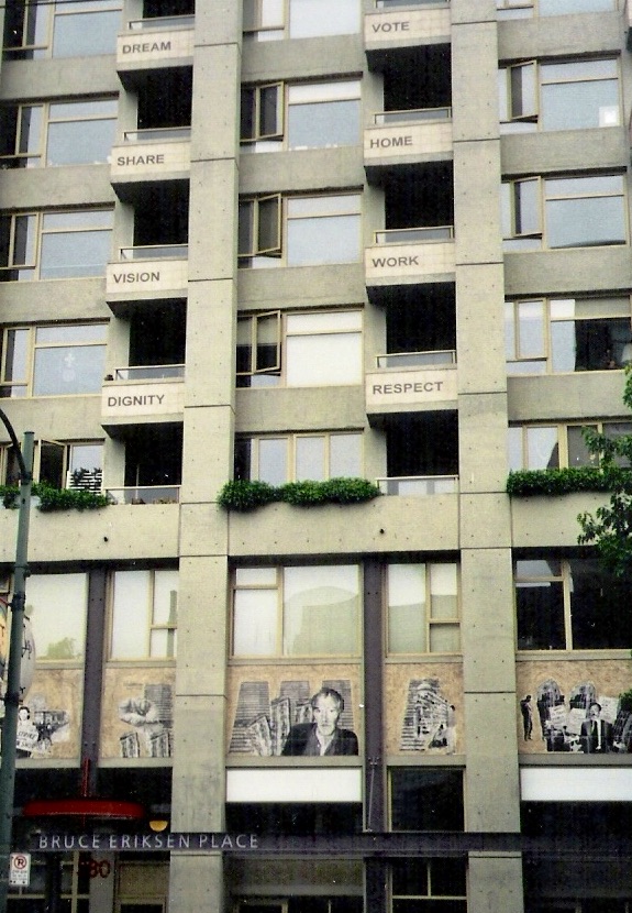 An affordable housing building in Vancouver with inspiring signage such as "dignity, vision, work, home." Image: Cathy Crowe