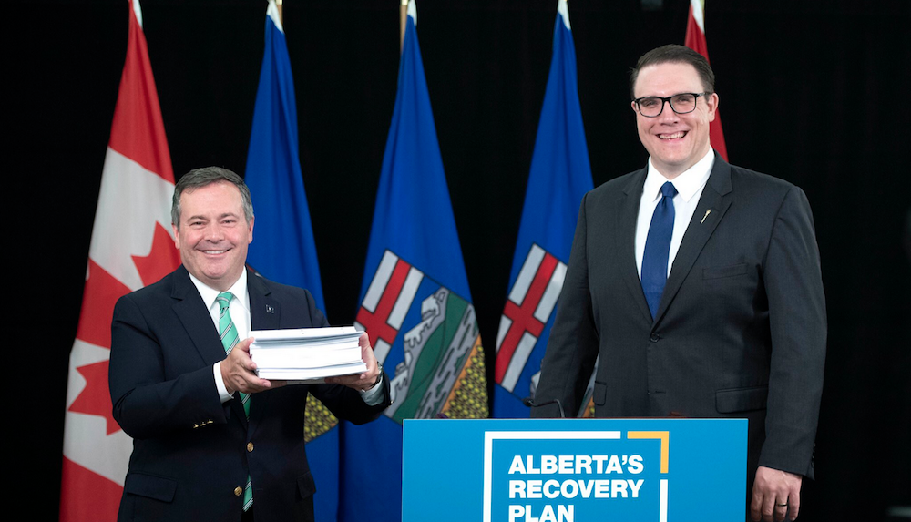 Jason Kenney and Jason Nixon with a big stack of paper yesterday. Image: Jason Kenney/Facebook