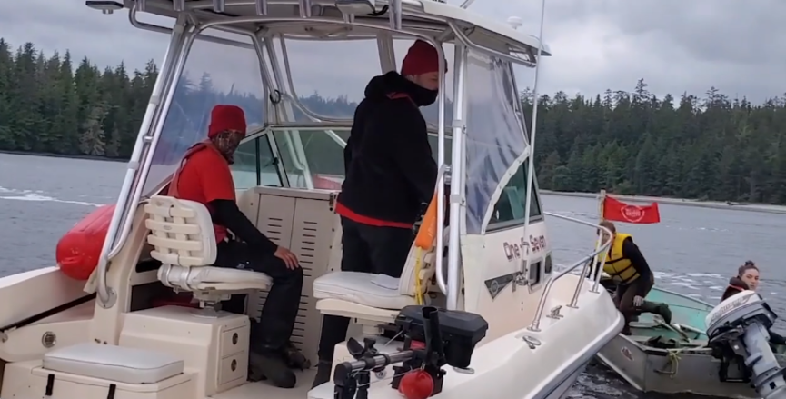 Image shows fishermen spotted by G̲aandlee Guu Jaalang, "Daughters of the Rivers," who are the Haida women who have responsibility to protect Haida Gwaii. Image: G̲aandlee Guu Jaalang/Screenshot of Facebook video