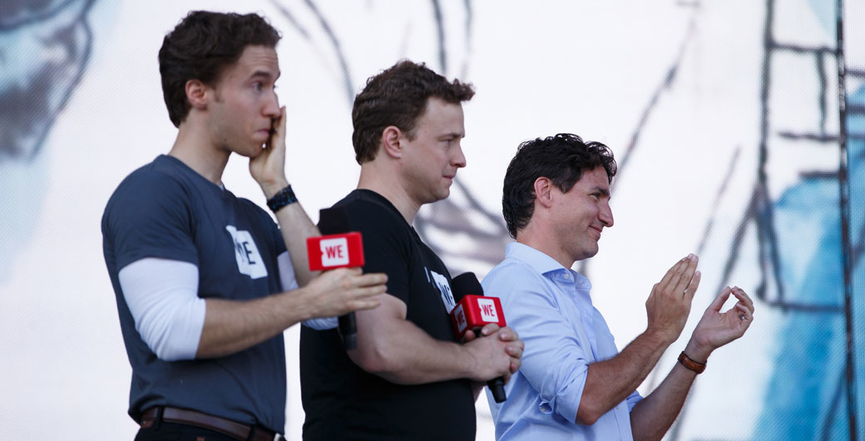 Trudeau with Marc and Craig Kielburger at a WE Day event in 2017. Image: Adam Scotti/PMO