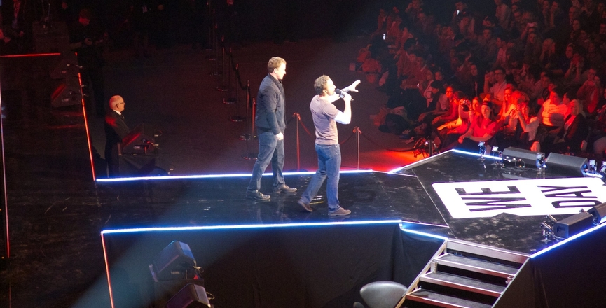 Marc and Craig Kielburger at a WE Day event in the U.K. in 2014. Image: Paul Williams/Flickr