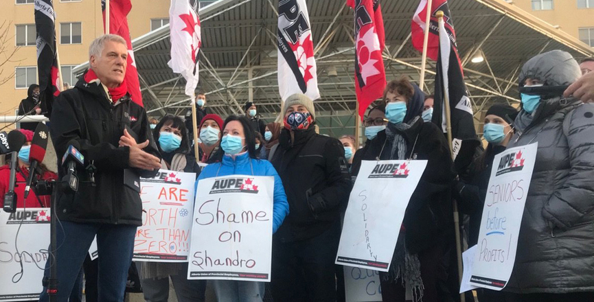 Guy Smith, president of the AUPE, addresses the media outside of the Royal Alexandra Hospital in Edmonton (Image: Courtesy of ProgressReport.ca)