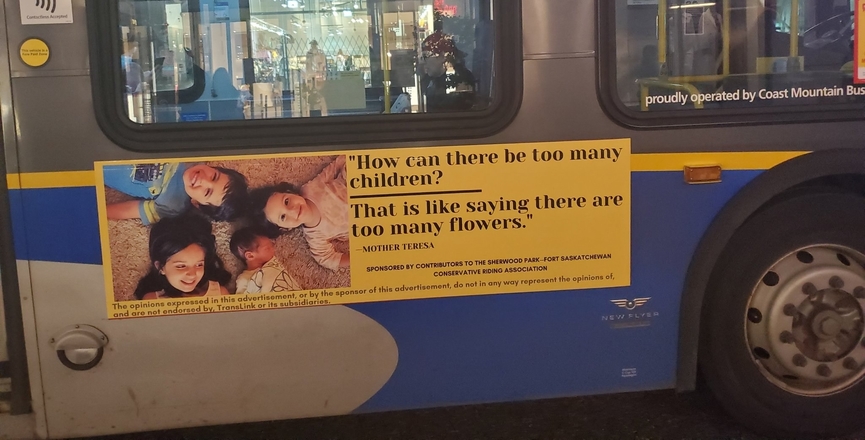 The ad pictured on a Vancouver bus. Image: Garnett Genuis/Twitter