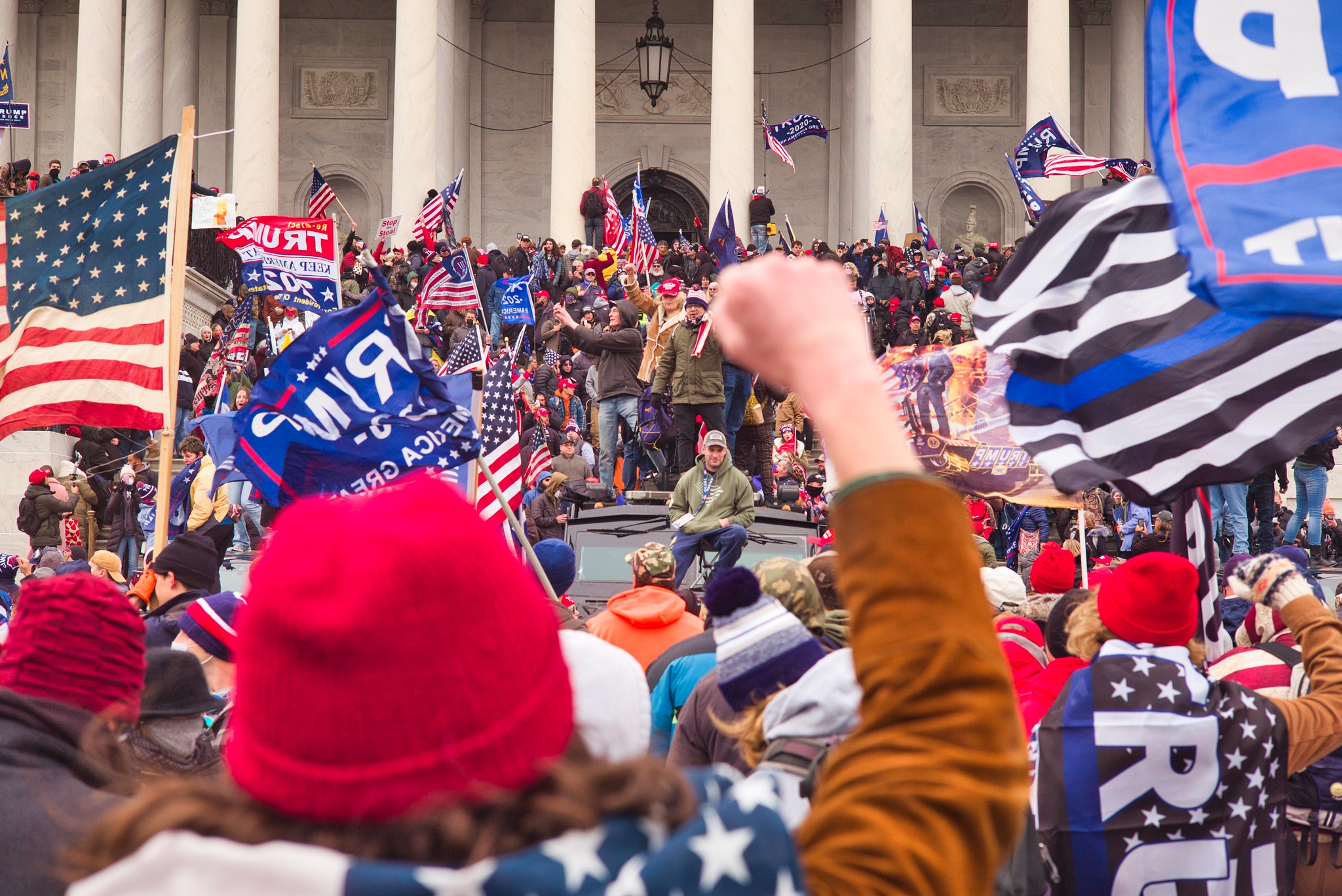 Pro-Trump mob on steps of U.S. Capitol. Image credit: Brett Davis/Flickr