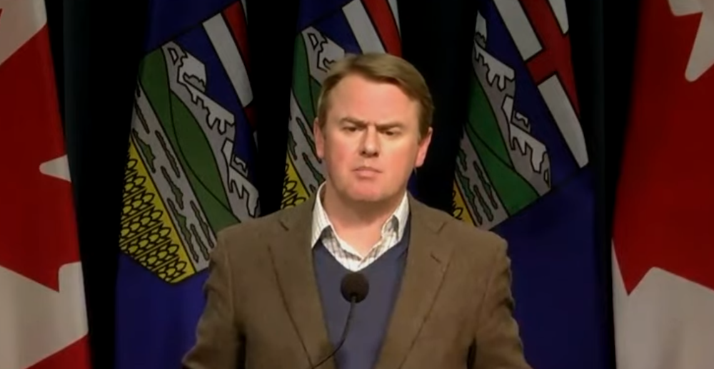 Alberta Health Minister Tyler Shandro bashes Justin Trudeau at yesterday's daily COVID briefing. Image: Screenshot of Alberta government video