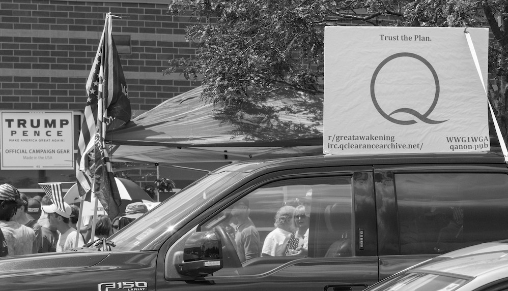 Truck displays Trump election sign and QAnon sign. Image: Becker1999/Flickr