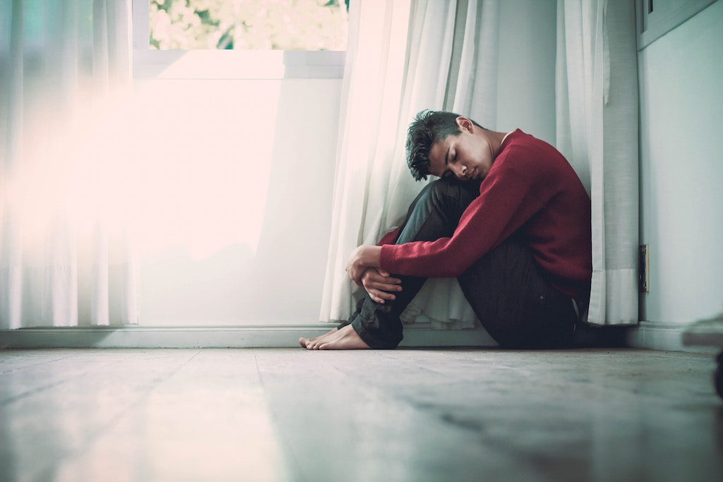 Man beside window. Image credit: Fernando @cferdo/Unsplash