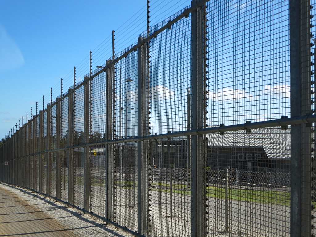 Detention centre fencing in Australia. Image credit: David Stanley/Wikimedia Commons