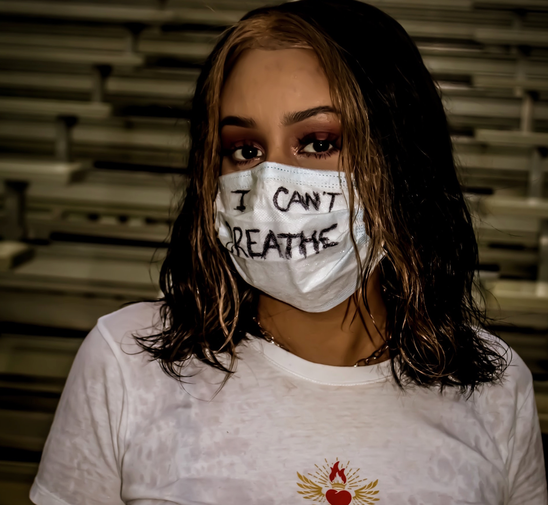 Person wearing mask with words "I can't breathe." Image credit: David Ramos/Unsplash