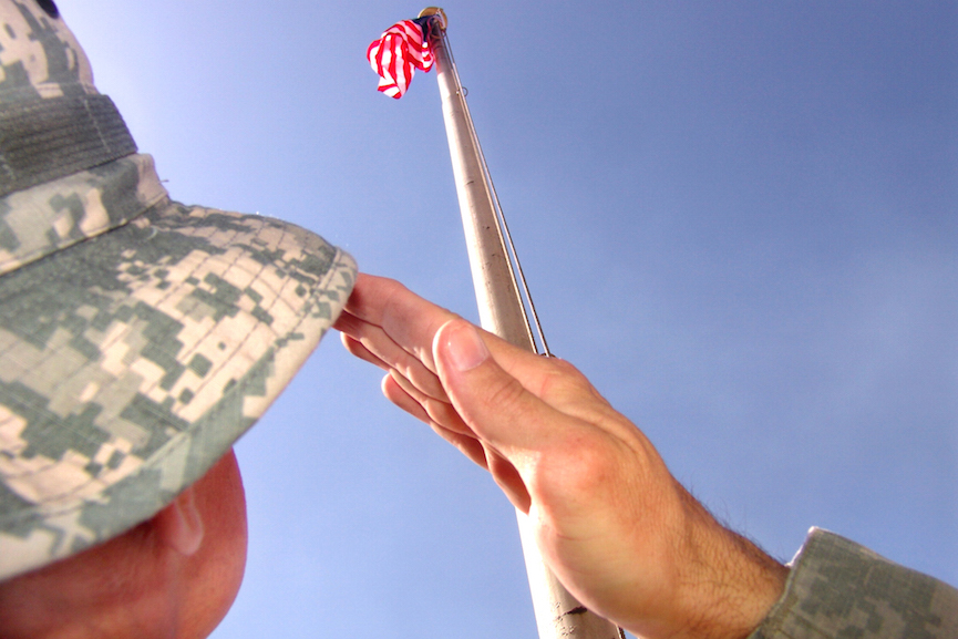 U.S. soldier salutes American flag. Image credit: The U.S. Army/Flickr