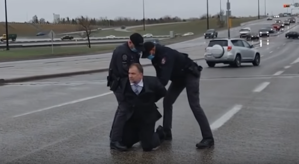 Calgary Police arrest political cleric Artur Pawlowski on Saturday for defying public health orders. Image: Screenshot of YouTube video
