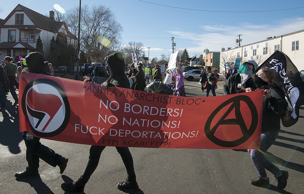 Protesters hold an antifa banner in Minneapolis, 2017. Image credit: Fibonacci Blue/Wikimedia Commons