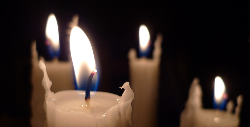 Four candles. Image credit: Christopher Bulle/Flickr.