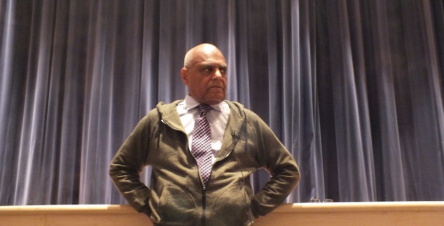 Bob Moses stands in a school auditorium for an exhibition on Freedom Summer in 2014. Image: Princeton Public Library/Flickr