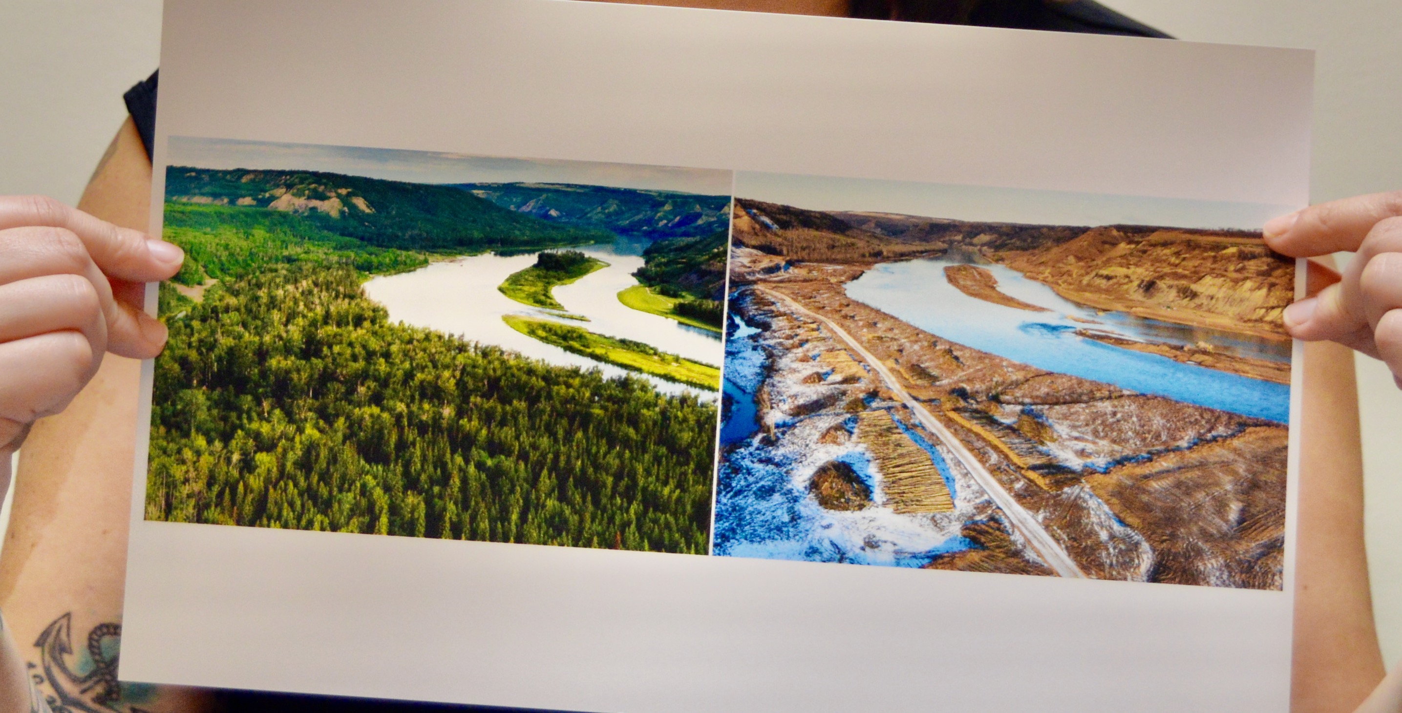Helen Knott of West Moberly First Nation holds up contrasting images of Peace River, before and after dam construction began, in 2016. Image: Chelsea Nash/Used with permission