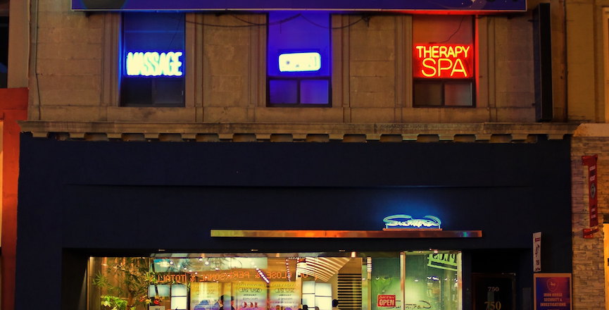Neon massage parlour signs above a restaurant in Downtown Toronto, taken in 2006. Image: Ryan/Flickr