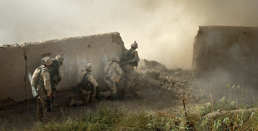 Soldiers from the Royal Canadian Regiment burst into a suspected Taliban stronghold in in Pashmul in 2006. Image: Graeme Smith/Queen's Own Rifles of Canada Regimental Museum/Flickr