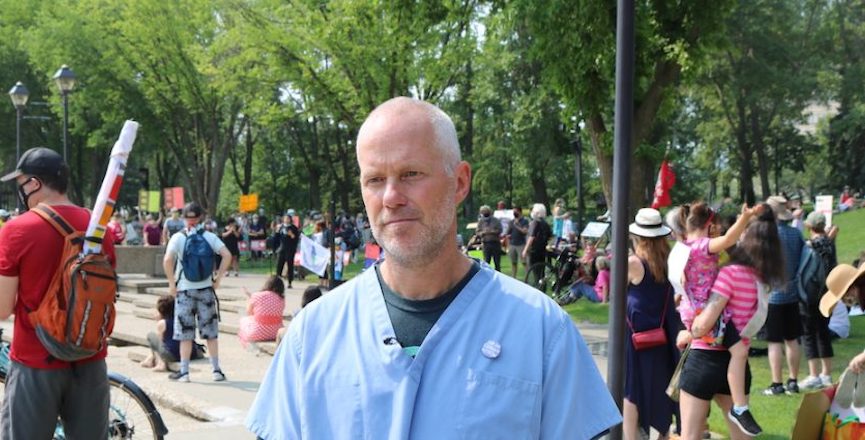 Calgary physician Joe Vipond at a recent rally in Edmonton pushing the Kenney Government not to abandon COVID-19 testing, tracing and isolation. Image: David J. Climenhaga/Used with permission