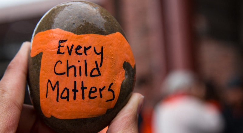 Every Child Matters painted on a pebble. Image: BC Gov/Flickr