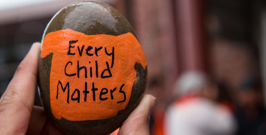 Every Child Matters painted on a pebble. Image: BC Gov/Flickr