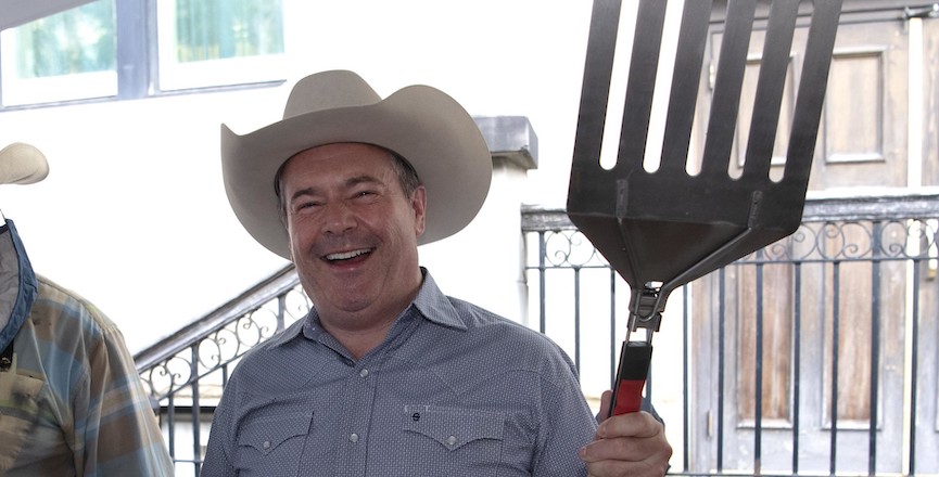 Jason Kenney flips pancakes at the Calgary Stampede. Image: Chris Schwarz/Government of Alberta/Flickr