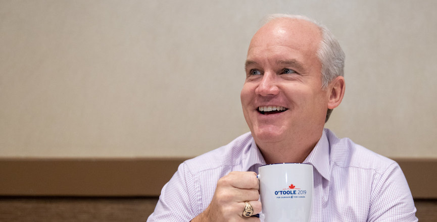 Erin O'Toole smiles with a mug in his hand on day two of the 2021 election campaign. Image: Erin O'Toole/Flickr