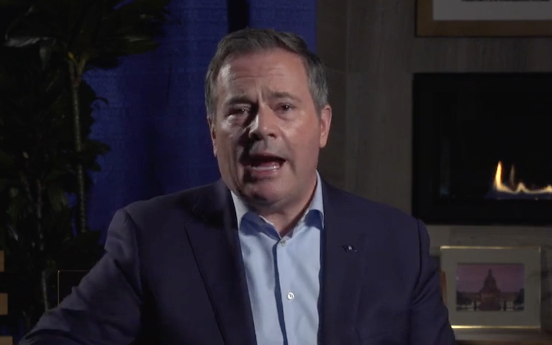 Alberta United Conservative Party Premier Jason Kenney, literally partly lit by a gas fire, during his Facebook Live performance yesterday (Photo: Screenshot of Facebook Live).