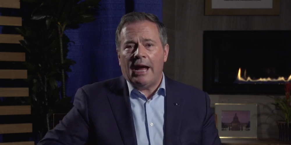 Alberta United Conservative Party Premier Jason Kenney, literally partly lit by a gas fire, during his Facebook Live performance yesterday (Photo: Screenshot of Facebook Live).