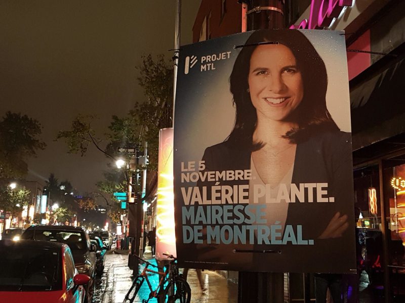 A Valérie Plante campaign sign from the 2017 Montreal municipal election on Rue Sainte-Catherine E at night.