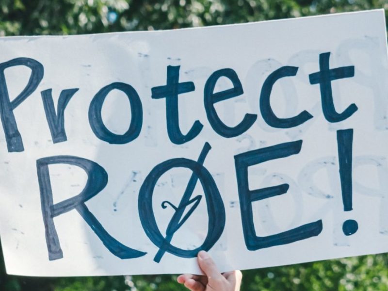 A protestor carries a poster that read "Protect Roe."